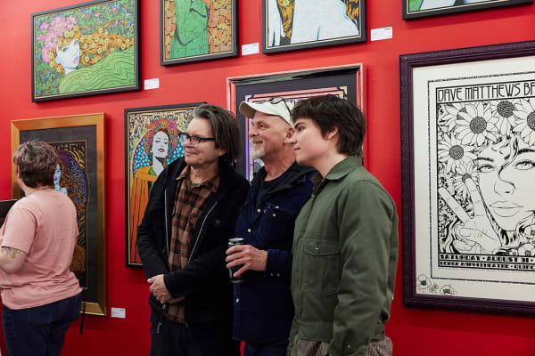Chuck Sperry poses with fans at the opening of Only Human.