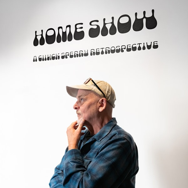 image of artist Chuck Sperry from the opening night reception for his retrospective: "Home Show" at the Haight Street Art Center