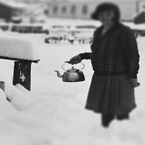 Detail from Joseph Divis’ photo of Woman filling kettle from water tank, surrounded by snow. Alexander Turnbull Library, New Zealand: 1/2-233261-G