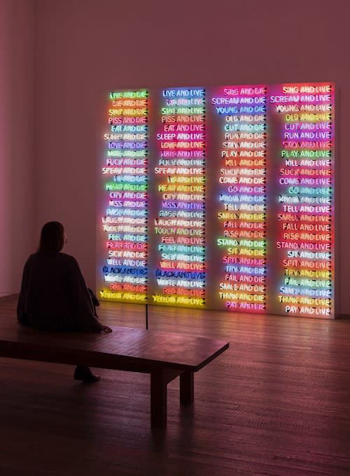 Installation view of Bruce Nauman at Tate Modern featuring One Hundred Live and Die 1984. Photograph by Tate Photography (Matt Greenwood). Artwork (c) Bruce Nauman / ARS, NY and DACS, London 2020