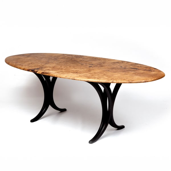 The Epicormic dining table has a burr oak top and a scorched oak understructure.