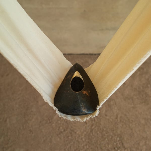 Abdus Salaam The Arrowheart, 2024 Foraged & sculpted Dolomite from the Cradle of Humankind, South Africa, pure platinum, and a single five Rand coin, suspended in 270 gram cotton canvas 25 x 15 cm | 9.84 x 5.91 in