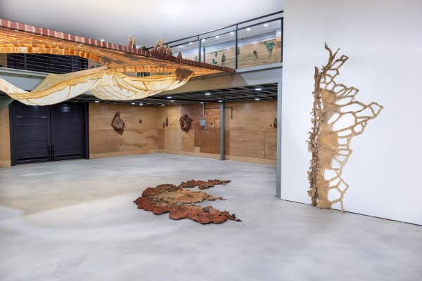 An installation view of Carlie Trosclair's solo exhibition at Sibyl Gallery, allowed our edges to merge, featuring largescale cast latex sculptural installations
