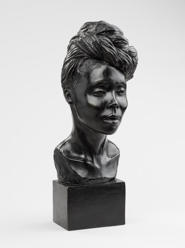 Photo of artist Mario Moore's sculpture titled Love. It is a bust of a Black woman wearing her hair in a large bun wrapped atop her head.