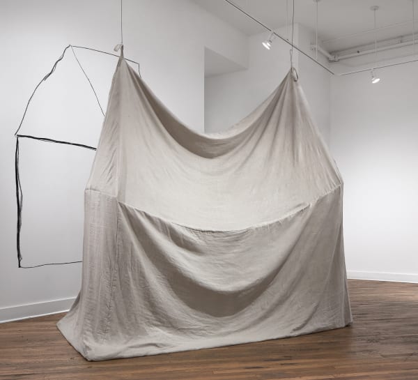 Iris Eichenberg installation of a house-like structure made out of linen cloth and suspended from the gallery ceiling.