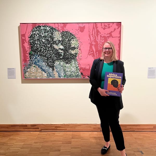 Gallery director Stella Melbye-Konan in front of the exhibited artwork Yeanzi