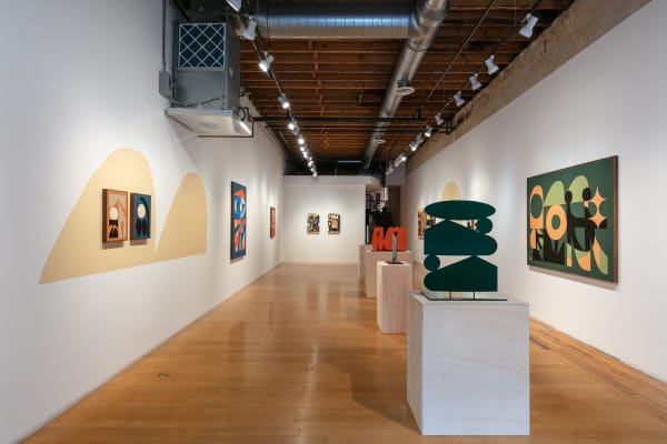 Installation view of the gallery from the front door facing the back wall.