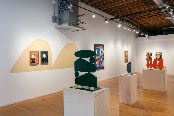 Installation shot of the left wall of the gallery with three sculptures sitting on plywood pedestals in the middle of the gallery.