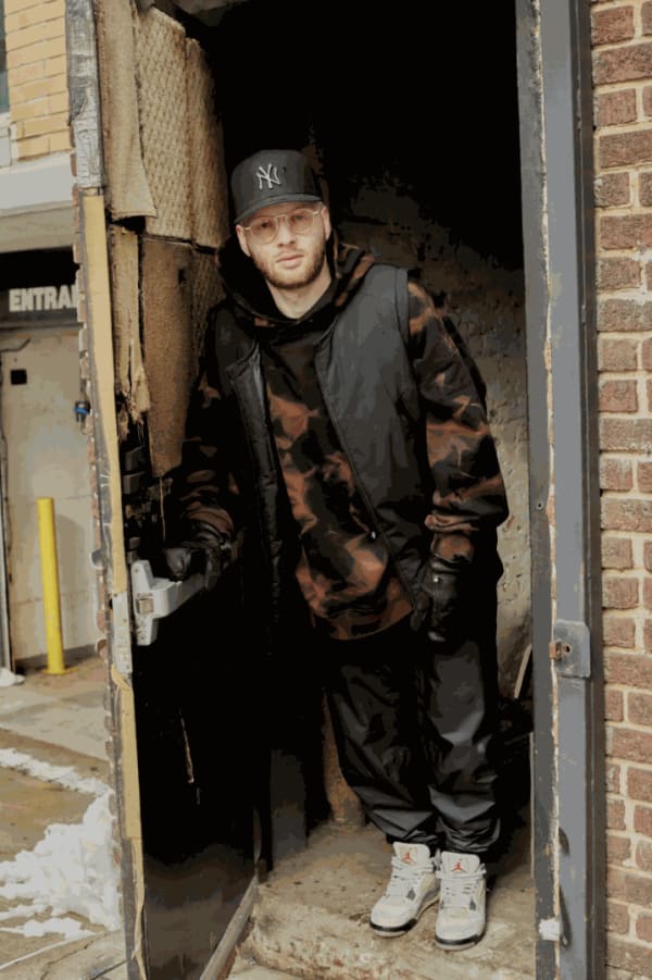 Julius Margulies, a.k.a. Snuffy, at the entrance of his tattoo studio in the Williamsburg section of Brooklyn. Credit: Timothy R. Mahoney for The New York Times.