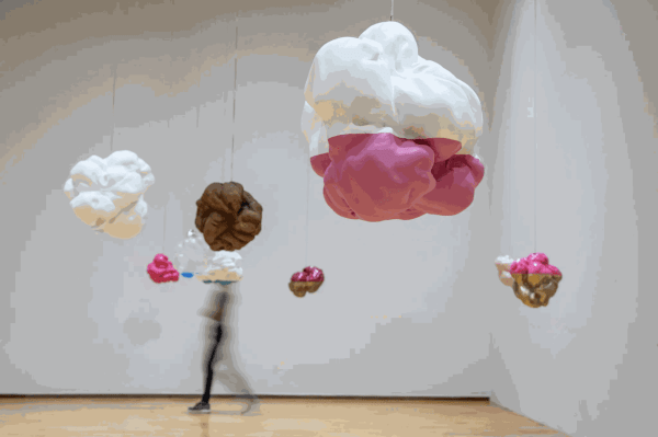 Kim Faler’s “Double Bubble” (2019-2020), left, part of the exhibition “Kissing through a Curtain” at Mass MoCA. The group show is about what gets lost and gained in the act of translation — between cultures, languages, people and media.Credit...Tony Cenicola/The New York Times