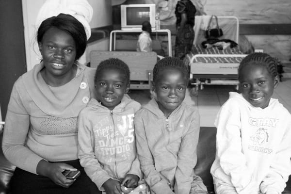 A mother and her children at Kitwe Hospital Eye Annexe, Zambia