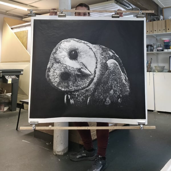 Owl linocut art print on black background by Niocla Wallis