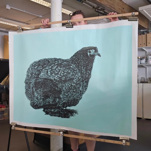 Contemporary linocut print of a hen on a blue background