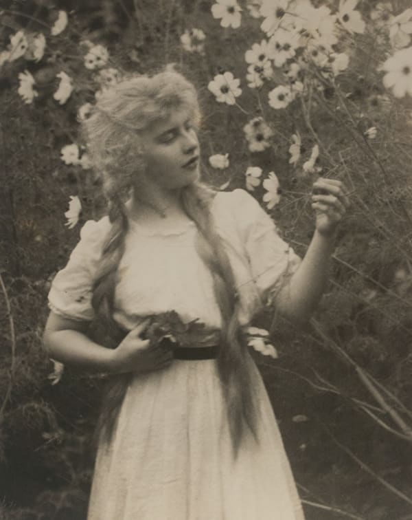 Paul Outerbridge, Untitled (Woman with Braids Picking Flowers), 1918