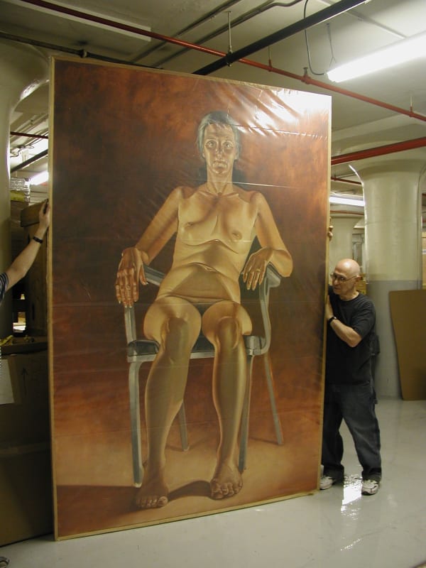 Alfred Leslie in his studio with one of his portraits