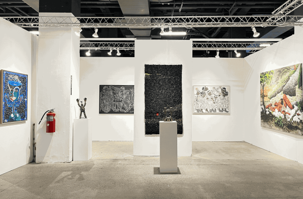 Installation view of AFIKARIS Gallery's booth at 1-54 New York at fair in Chelsea featuring works by Salifou Lindou, Jean David Nkot, Eva Obodo and Hervé Yamguen