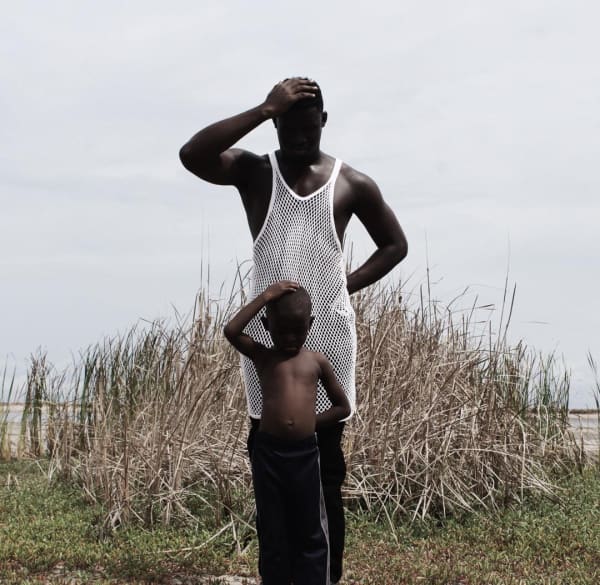 Photograph by Nana Yaw Oduro showing a dad and his son