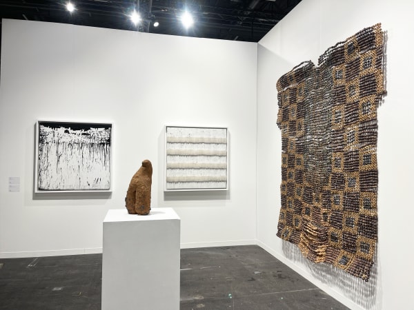 View of AFIKARIS Gallery's booth at Art Genève featuring works by Mouhcine Rahaoui, Ozioma Onuzulike and Salifou Lindou
