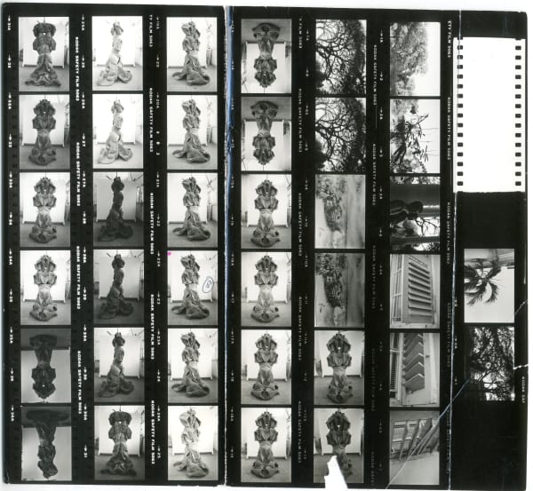 A contact sheet that captured the evolution of Devi on Mukherjee’s Nizamuddin terrace. The sequential images not only follow the sculpture’s formation but also capture the studio’s lived-in atmosphere—trees in the periphery, visitors passing through, a cooler humming nearby.