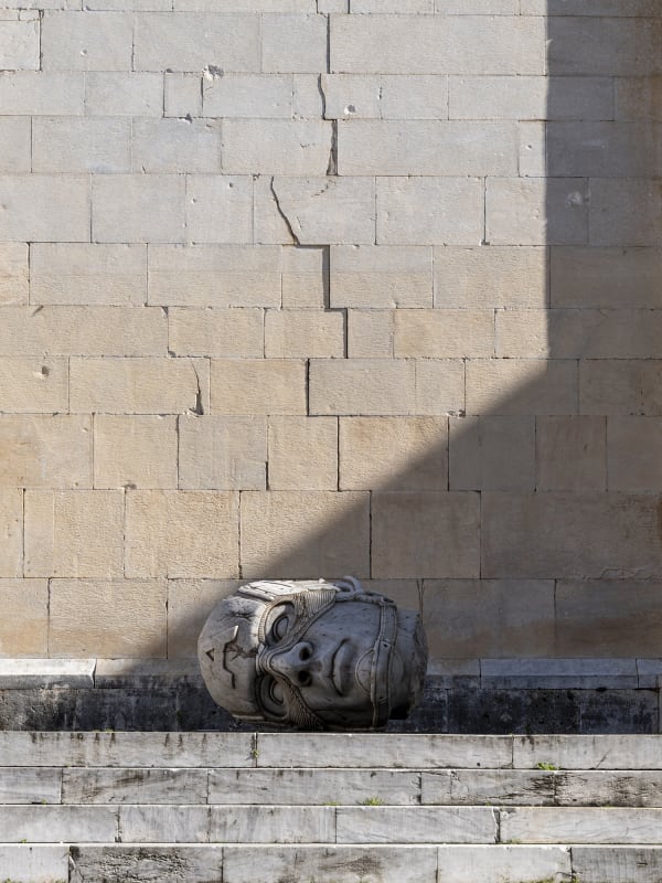 Marble sculpture featuring a spaceman his suit fill of flowers, part of the 'Spaceman' series by artist Filippo Tincolini view from the front