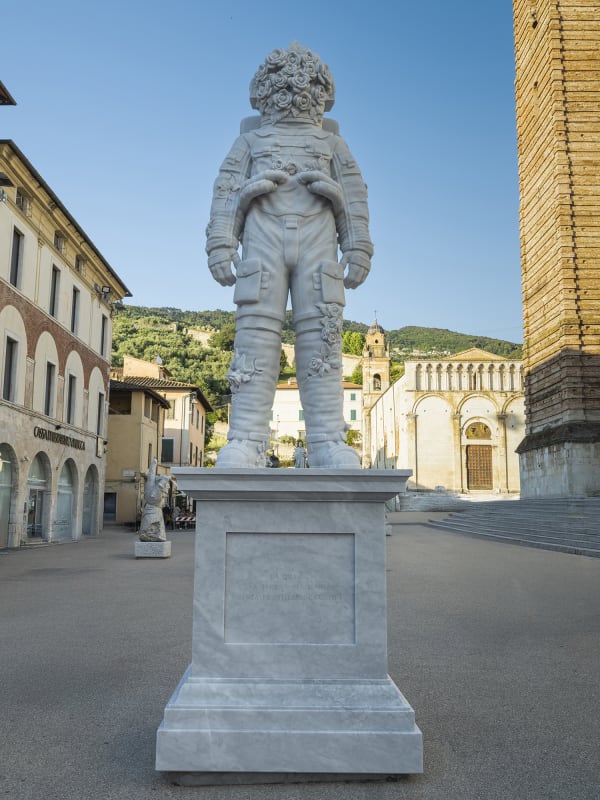Marble sculpture featuring a spaceman his suit fill of flowers, part of the 'Spaceman' series by artist Filippo Tincolini view from the front