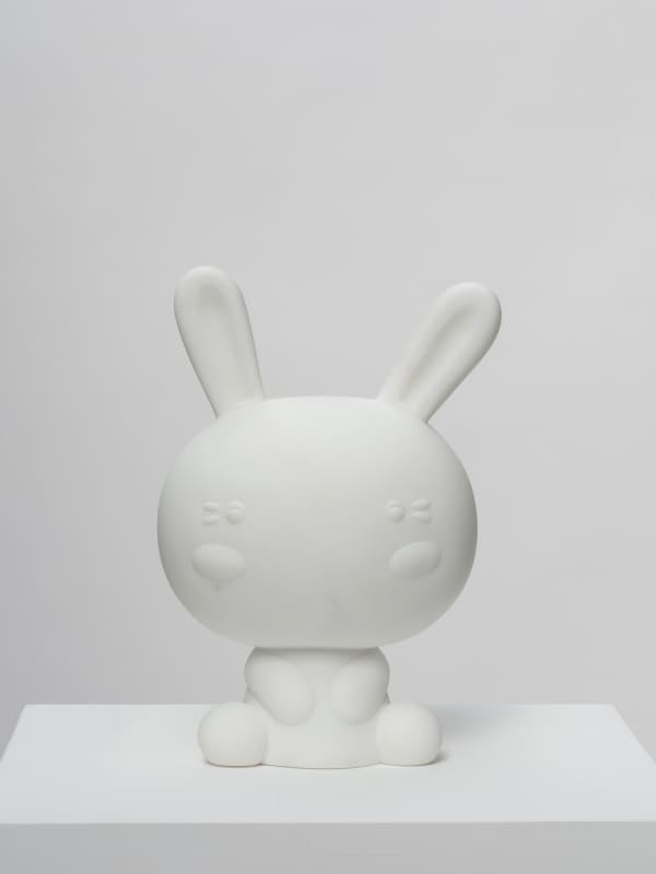 Marble sculpture featuring a manga, part of the 'Toys' series by artist Filippo Tincolini view from the front