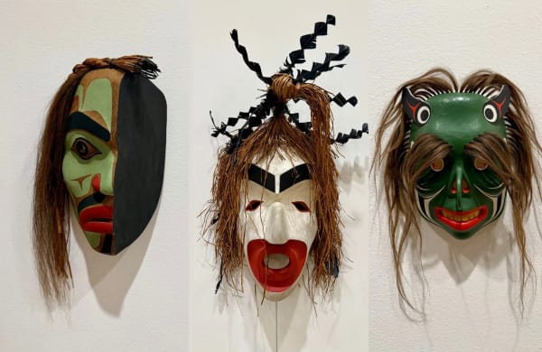 Three separate masks by Beau Dick (L-R): "Ridicule Mask"; "Pook-mis Mask" ("Spirit of the Nearly Drowned"); and "Bookwoos," all featured in 'Insatiable Beings' at the Frye Art Museum. (Brangien Davis/Cascade PBS)