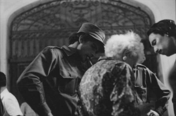 Cuban armed forces and civilians pictured on the street in Havana. Click to read more