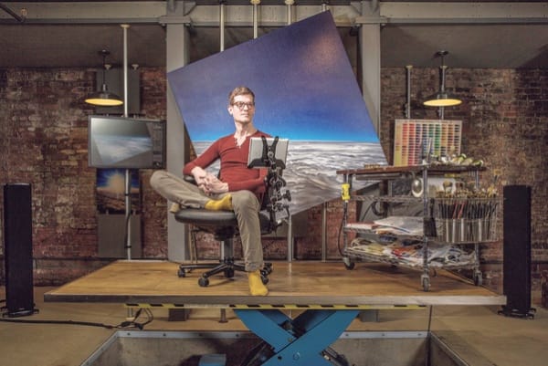 Damian Loeb sits in front of his 2014 painting 'Hoth' in his studio in New York. Sasha Maslov for The Wall Street Journal