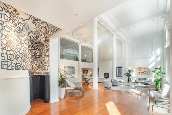 An 8,000 square foot triplex loft has been converted to a private residence, with the original mural intact.