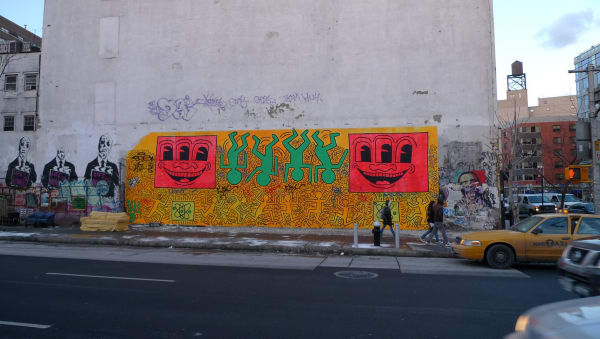 Keith Haring's Mural Intersection of Huston and Bowery, East Village, NY. Photo by focusc is licensed under CC BY 2.0. Taken on January 15, 2009