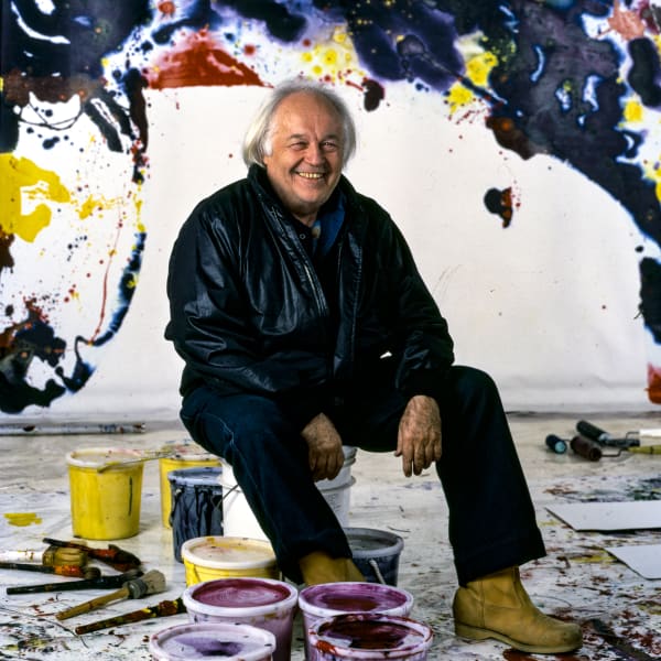 Sam Francis in his Studio with the Monumental Whirling Square behind him.