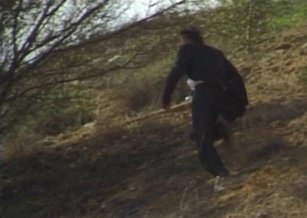 Ariel Yannay | All Loves are Difficult | Still of a figure in motion within a landscape, from the trilogy You Wait and I’ll Be Back