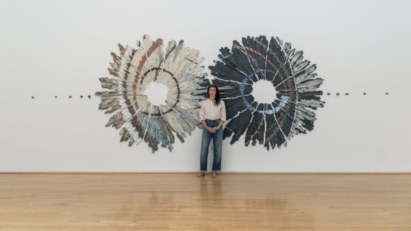 The artist with her work in Brie Ruais: Movement at the Edge of the Land. Photo by Nash Baker, courtesy of the Moody Center for the Arts, Rice University, Houston