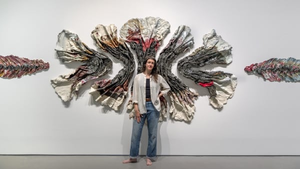 The artist with her work in Brie Ruais: Movement at the Edge of the Land. Photo by Nash Baker, courtesy of the Moody Center for the Arts, Rice University, Houston