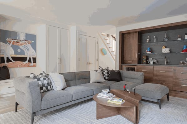 The homeowner was drawn to the soft colors and figurative storytelling in James Parker Foley’s Raising the Dory, an oil painting he purchased from Abigail Ogilvy Gallery in SoWa. / Photo by Michael J. Lee