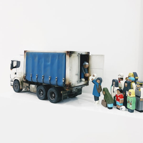 Early Learning Counting Set by Banksy featuring a toy truck with figures, including children and adults, in a playful scene
