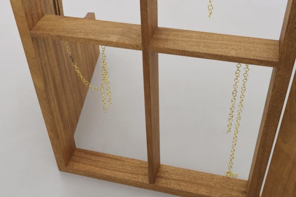 Detail, homeview 1, 2022, Congo’s mahogany wood, brass chains, 100 x 180 x 8 cm