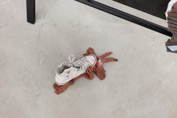 Wile E. Coyote Goes for a Walk (Left), 2019, shoe, spray-paint on clay, 23 x 41 x 21 cm