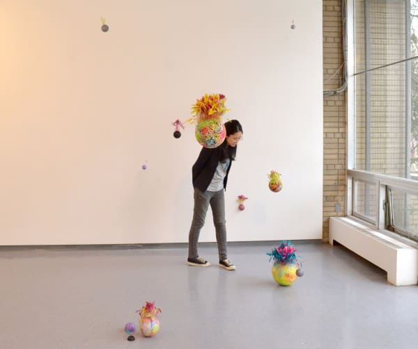 Conundrum, 2017, feather, styrofoam, pattern fabric, acrylic, glitter, dimensions variable