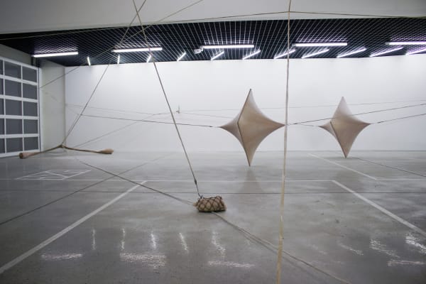 A Single Leg of Moderate Speed, 2015, 5 sculptures that connected to each other, 1 performance video for documenting sculpture: aluminum frame, fabric, latex, silicone, cotton, aqua resin, glass funnels, metal, hulahoop