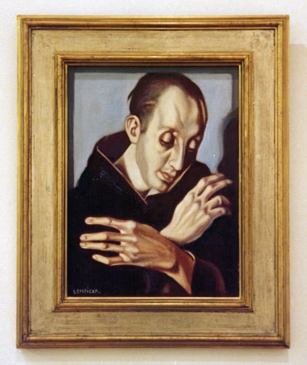 Saint Anthony sits and holds his hands in front of his person