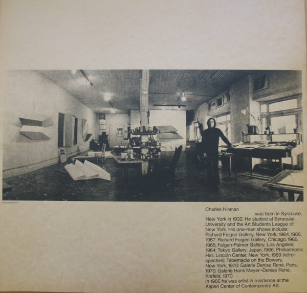 Black and white photograph of Charles Hinman in his studio with text underneath