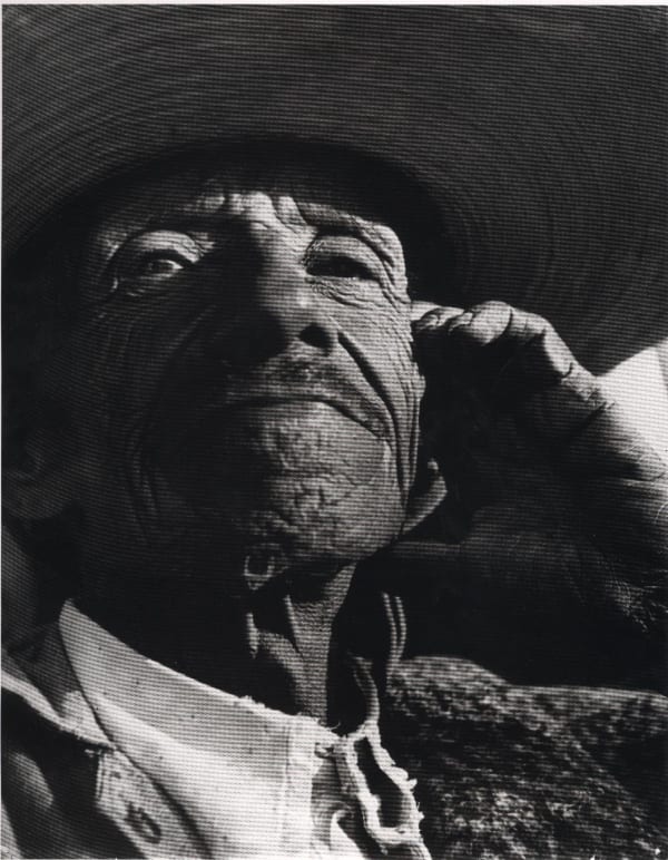 Close up black and white photograph of old man