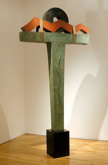Black, orange, and green t-shaped sculpture