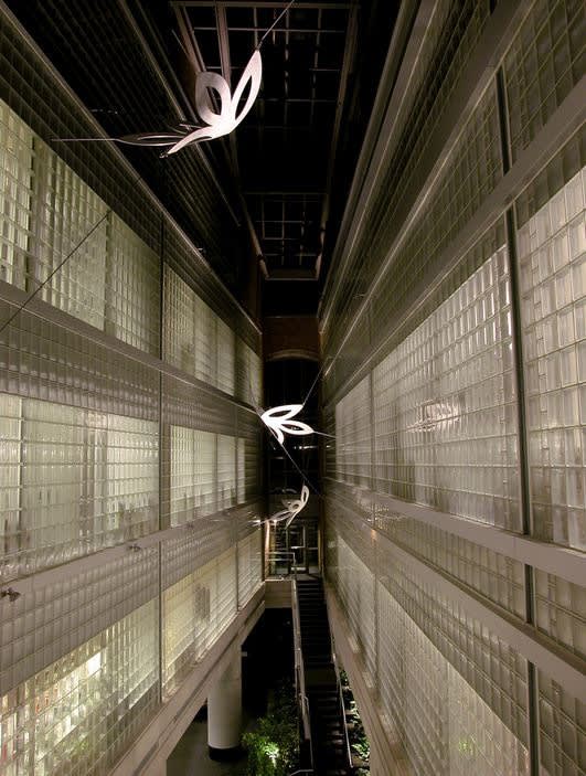 Silver sculptures suspended between buildings