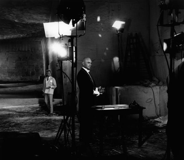 black and white photograph of Jean Cocteau and Yul Brynner between film takes