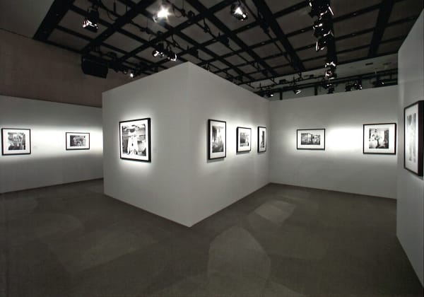 Installation view of the exhibition Coco Chanel, 1962: Photographs by Douglas Kirkland featuring several black and white photographs of Coco Chanel in Ginza, Tokyo