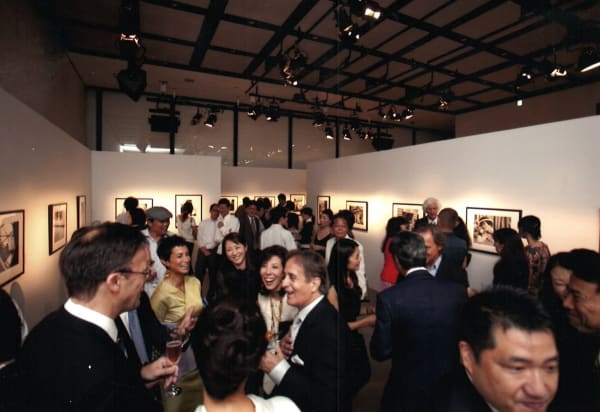 View of a large crowd at the opening reception of the exhibition, Coco Chanel, 1962: Photographs by Douglas Kirkland in Tokyo