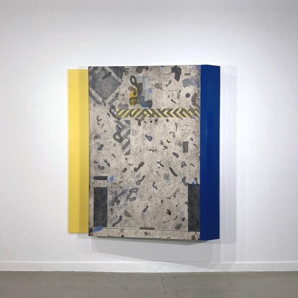 Photograph of an irregularly shaped geometric abstract painting on a white wall